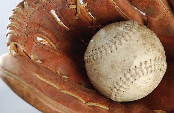 Baseball in brown leather baseball glove